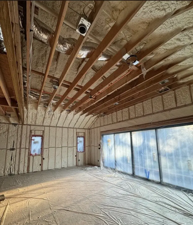 Interior walls and ceiling insulated with spray foam during new construction in Windsor